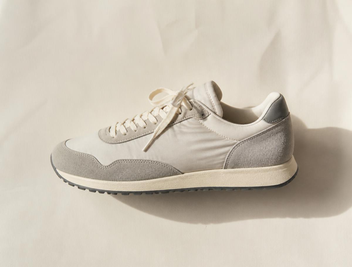 A sneaker photographed on warm paper for an AI legit check